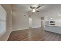Open living room with hardwood floors and kitchen at 854 4Th St, Winter Haven, FL 33881