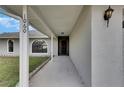 Inviting covered entryway leading to front door at 1060 Colony Park Dr, Lakeland, FL 33813