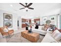 Bright, open-concept living room featuring a ceiling fan and stylish decor at 5295 Sw 87Th Ter, Ocala, FL 34481