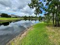 Scenic view of the community pond, reflecting the sky and the neighboring condos at 200 Lemon Tree Ln # A, Ormond Beach, FL 32174