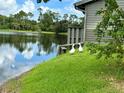 Picturesque lakeside view of the community pond, with visiting wildlife at 200 Lemon Tree Ln # A, Ormond Beach, FL 32174