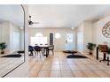 Bright dining area features tile flooring, a modern table set, arched windows, and a stylish welcome sign at 331 Marquee Dr, Kissimmee, FL 34758