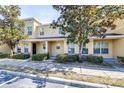 Inviting townhome exterior showcasing well-maintained landscaping and a covered front entrance at 5409 Limestone Ln, Lakeland, FL 33809