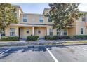 Townhome exterior featuring a well-kept lawn and a covered entry for a welcoming first impression at 5409 Limestone Ln, Lakeland, FL 33809