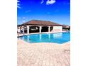 Community pool with a covered pavilion, offering a relaxing atmosphere at 3088 Pointe Place Ave, Kissimmee, FL 34758