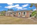 Attractive brick home featuring white shutters and charming flower boxes under the windows at 3603 Royal S Ct, Lakeland, FL 33812