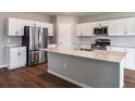Modern kitchen featuring stainless steel appliances, white cabinets and an island at 1901 Harrods Pl, Haines City, FL 33844