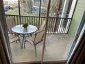 Relaxing outdoor patio with table and chairs perfect for enjoying the view at 705 Gran Bahama Blvd # 705, Davenport, FL 33897