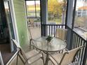 Screened in patio with outdoor table and chairs at 705 Gran Bahama Blvd # 705, Davenport, FL 33897