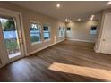 Bright living room with wood floors and multiple windows at 1632 Haven Dr, Orlando, FL 32803