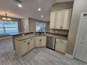 Well-lit kitchen with stainless steel appliances, granite countertops, and modern cabinetry at 1260 Buckeye Ne Rd, Winter Haven, FL 33881