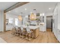 Bright, modern kitchen featuring a large island, custom cabinetry, and pendant lighting at 472 Desoto Dr, New Smyrna Beach, FL 32169