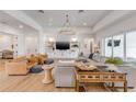 Open-concept living room featuring hardwood floors and stylish furnishings at 472 Desoto Dr, New Smyrna Beach, FL 32169