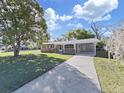 Charming single-story home with a well-maintained lawn and covered entryway at 917 E Valencia St, Lakeland, FL 33805