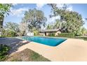 Backyard pool with a spacious deck, ready for relaxation and entertainment at 800 22Nd Nw St, Winter Haven, FL 33881