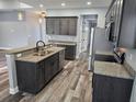 Well-equipped kitchen with granite countertops, stainless steel appliances, and dark wood cabinets at 1264 Buckeye Ne Rd, Winter Haven, FL 33881