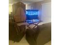 Relaxing living room with recliner chairs, entertainment center, and fish tank at 101 Bent Tree Dr # 12, Daytona Beach, FL 32114