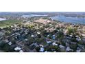 Picturesque aerial shot of a community near a lake, showcasing residential areas with a school and water tower at 1625 Avenue D Ne, Winter Haven, FL 33881