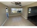 Bright dining area features tile flooring and a large window overlooking the front yard at 100 High St, Winter Haven, FL 33880