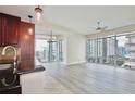 Bright, airy living room featuring hardwood floors, floor-to-ceiling windows, and an open-concept layout at 101 S Eola Dr # 813, Orlando, FL 32801