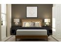 Serene bedroom featuring a modern bed frame, stylish nightstands, lamps, and a baseball diamond art piece at 4156 Singing Mockingbird Blvd, Bartow, FL 33830