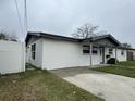 A charming single-story home featuring a well-maintained front yard and a concrete driveway at 427 Donald St, Lakeland, FL 33813