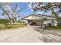 Large, covered carport area providing ample parking and shelter from the elements at 2640 Oak Dr, Bartow, FL 33830