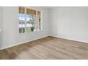 Cozy bedroom with light floors and a large window, providing ample natural light at 2726 Herons Landing Dr, Kissimmee, FL 34741