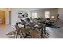 Open-concept living and dining area featuring modern decor and ample natural light at 4759 Golden Knight Blvd, Kissimmee, FL 34746