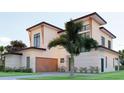 Elegant two-story house boasting contemporary design with a flat roof and vibrant landscaping at 607 Ellen Dr, Winter Park, FL 32789