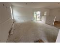 Bright living room with sliding glass doors to the back and a view of the back yard at 222 Carpenters Way # 68, Lakeland, FL 33805