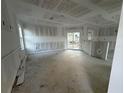 Spacious living room area with a sliding glass door opening to the outside at 222 Carpenters Way # 68, Lakeland, FL 33805