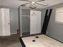 A bedroom featuring gray walls, carpet, and a closet at 4801 Avon St, Lake Wales, FL 33859