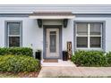 Welcoming front entrance with decorative plants, and stylish door at 3798 Plainview Dr, Orlando, FL 32824