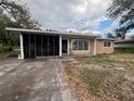 A cozy single-story home featuring a screened-in porch and a small front yard, ready for personalization at 111 2Nd St # Jpv, Winter Haven, FL 33880