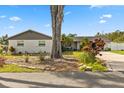 Landscaped front yard with a mature tree and lush plantings that enhance the curb appeal of the property at 5029 Sheffield Rd, Lakeland, FL 33813