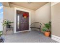 Inviting front porch featuring a decorative door and a cozy bench for relaxing at 1724 Holton Rd, Lakeland, FL 33810