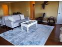 Comfortable living room with stylish furniture and a decorative rug at 2404 Waycross Ave, Eustis, FL 32726