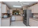 Bright kitchen featuring stainless steel appliances and a large window at 2009 Salinas Ave, Lady Lake, FL 32159