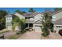 Beautiful townhome with an attached garage, well-kept lawn, and a welcoming front entrance at 6455 Sedgeford Dr, Lakeland, FL 33811