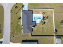 Birds-eye view of the home, pool, fenced backyard, and surrounding neighborhood at 17 Se 61St Ct, Ocala, FL 34472