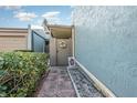 Charming townhouse entrance with brick walkway and decorative wreath at 2500 21St Nw St # 88, Winter Haven, FL 33881
