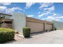 Townhouse featuring a one car garage, neutral-colored exterior, and manicured landscaping at 2500 21St Nw St # 88, Winter Haven, FL 33881