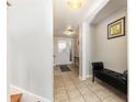 Welcoming foyer with tile floors, console table and neutral walls at 2500 21St Nw St # 88, Winter Haven, FL 33881