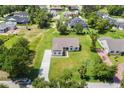 Aerial view of a home showcasing its expansive lawn and neighborhood setting at 2569 Rogers Rd, Lakeland, FL 33812