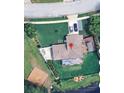 Aerial view of the property's layout including the spacious backyard, driveway, and nearby baseball field at 223 W Panama Rd, Winter Springs, FL 32708