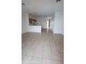 Open concept living space with tile flooring at 1533 Still Dr, Clermont, FL 34714