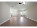 Open-concept living room featuring hard surface floors and lots of natural light at 7721 Somersworth Dr, Kissimmee, FL 34747