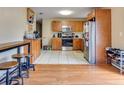 Bright kitchen with stainless steel appliances, wooden cabinets, and tile flooring at 1016 W 12Th St, Lakeland, FL 33805