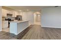 Modern kitchen with stainless steel appliances and a large center island at 1040 Cambridge Drive, Winter Haven, FL 33881